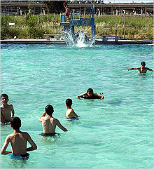 Chlorinated water is used in swimming pools to disinfect water from microbial contaminants Mosul-swimming.jpg