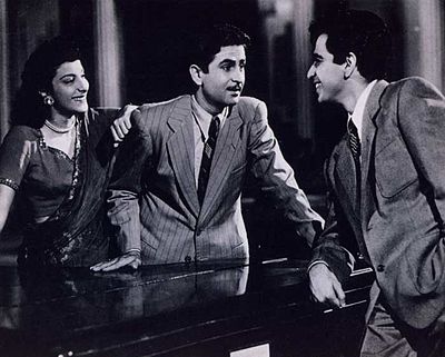 Nargis with actors Raj Kapoor and Dilip Kumar in a scene from their 1949 film Andaz