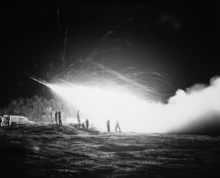 11th Marine Regiment's First Rocket Battery firing at night during the Korean War Night view of the First Rocket Battery, 11th Marine Regiment, firing a night mission, somewhere in the Marines front... - NARA - 532427 (restored).png
