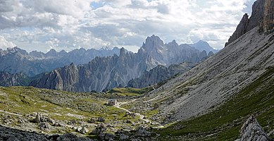 Panoramic view towards Rifugio Lavaredo from Lavaredo. Mountains in the background are part of Cadini di Misurina mountain group.