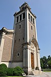 A stone church entranceway and steeple