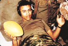 Shaggy during his military service with the United States Marine Corps. ShaggyMarinesWithFootball.png