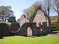 The ruins with St Oswald's Church in the background