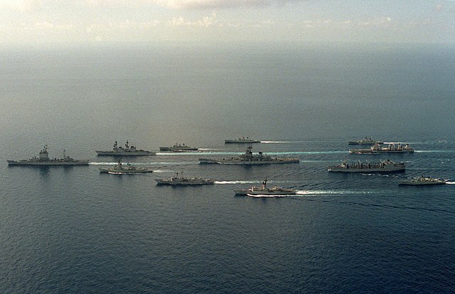 Hobart (second row from left, bottom) cruises as part of a joint US-Australian battle group around the US Navy battleship USS New Jersey