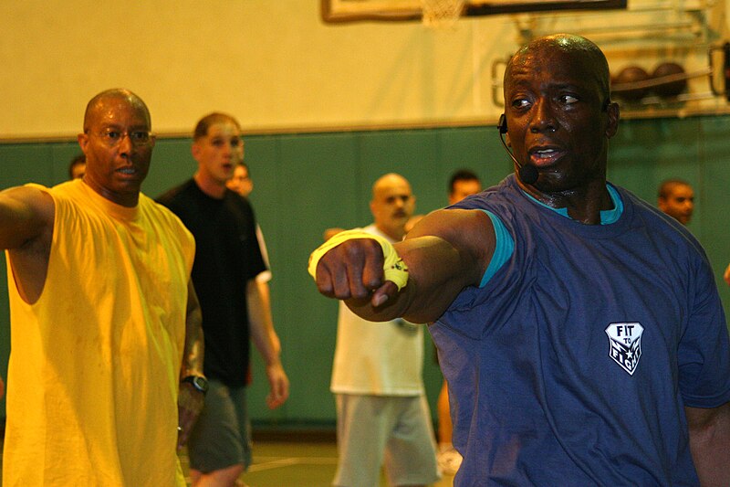 File:US Navy 060411-N-6270R-008 Commander, Fleet Activities, Commanding Officer Capt. Robert D. Wilson, Jr., left, stays focused, while he works out with Tae Bo creator, Billy Blanks.jpg