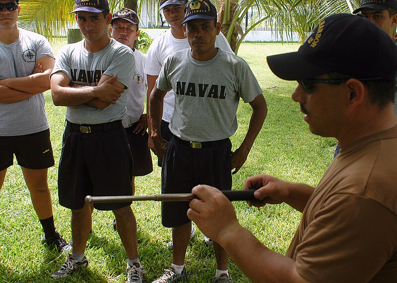 File:US Navy 070726-N-4021H-016 Boatswain's Mate 1st Class Ruben Cajero assigned to the dock landing ship USS Pearl Harbor (LSD 52), visit, board, search, and seizure (VBSS) team displays a baton technique.jpg