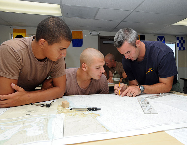 File:US Navy 080729-N-6552M-035 Special Boat Operator 1st Class Zach Riley teaches students how to lay out navigational tracks on a chart.jpg