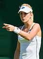 Urszula Radwańska competing in the first round of the 2015 Wimbledon Championships.