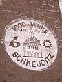 Teil einer alten Außenwerbung der VEB Edelpelz „1000 Jahre Schkeuditz“ (Aufnahme von 2005)