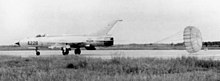 A missile-armed MiG-21PF of the VPAF 921st Fighter Regiment following a sortie VPAF MiG-21 landing with chute.jpg