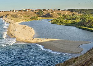 The estuary of the Veleka in the Black Sea. Longshore drift has deposited sediment along the shoreline which has led to the formation of a spit. Sinemorets, Bulgaria