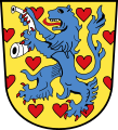 Gold, besät mit roten Herzen, ein blauer, rotbewehrter Löwe (Landkreis Gifhorn)