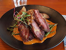 A wild boar dish served in Helsinki, Finland Wild Pork at Chico's.jpg