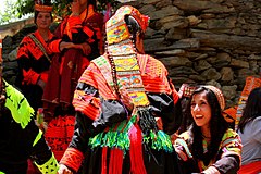 Woman wearing a traditional embroidered Kalash headdress, Pakistan.