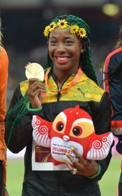 Fraser-Pryce in 2015 after winning her third 100 m world title.