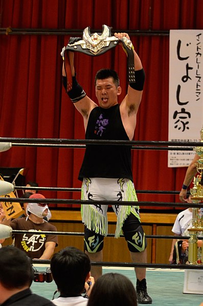 Fujita with one of the Tohoku Tag Team Championship belts.
