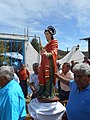 Procesión de devotos conduciendo la efigie de San Juan Evangelista en San Juan Achiutla, Oaxaca, México.jpg