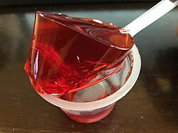 2019-10-10 22 15 43 Gelatin from a single opened cup of Jell-O strawberry gelatin snack being lifted by a spoon in the Franklin Farm section of Oak Hill, Fairfax County, Virginia.jpg