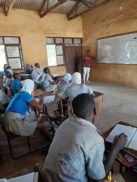 File:A teacher teaching his students in Northern Ghana.jpg