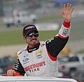 NASCAR Nationwide Series driver w:Alex Tagliani waves to the crowd at the 2014 Gardner Denver 200 event at Road America.   This file was uploaded with Commonist.