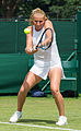 Alla Kudryavtseva competing in the first round of the 2015 Wimbledon Qualifying Tournament at the Bank of England Sports Grounds in Roehampton, England. The winners of three rounds of competition qualify for the main draw of Wimbledon the following week.