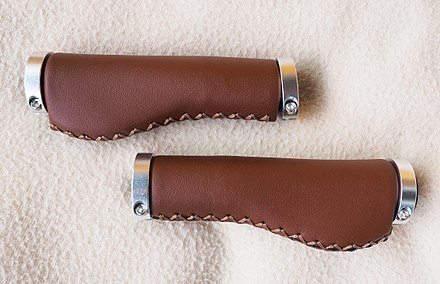 Bicycle grips made of leather. Anatomic shape distributes weight over palm area to prevent cyclist's palsy (ulnar syndrome).[56]