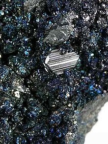 Sharp crystals of andorite (to 7 mm) with stannite matrix, San Jose Mine, Oruro Department, Bolivia Andorite-Stannite-201999.jpg