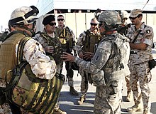 Italian Major General Giovanni Armentani, Deputy Commanding General for the NATO Training Mission, meets with a U.S. Advise and Assist Brigade. Armentani and Trujillo.jpg