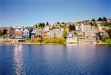 View of the city from the lakeside in summer