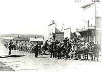 Photograph of Main Street in Minot in 1886. The Parker House is visible at the far right. Wagons of buffalo bones are also depicted. Buffalo Bones Minot.jpg