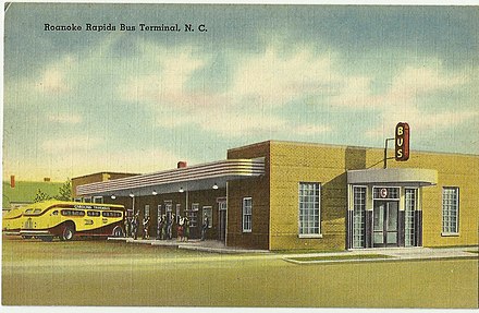 Carolina Trailways Bus Station, shown with a Carolina Trailways bus, in a postcard from the North Carolina State Archives