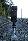 A signal near Duncannon, Pennsylvania, with a hand-written board showing "SP" to indicate that the signal is connected to a slide fence