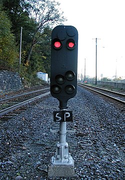 Hand-written slide protection placard on a PRR Pedestal type signal at CP-SOUTH FERRY indicates to engine crews that this signal is connected to a slide detector. CP-SOUTH-FERRY-North-Ped-STOP.jpg