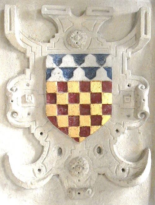 Arms of Sir John Chichester shown within a strapwork surround from his monument in Pilton Church: Chequy or and gules, a chief vair