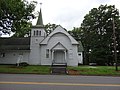 Entrance of Clover Apostolic Holiness Church. Located at 1049 Mt Laurel Road‎, Clover, Virginia. A small cemetery can be seen in the background at right.