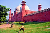 Cricket in Iqbal Park (Lahore) and Badshahi Mosque.jpg