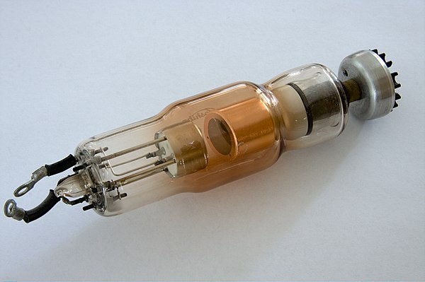 A modern dental X-ray tube. The heated cathode is on the left. Centre is the anode which is made from tungsten and embedded in the copper sleeve.