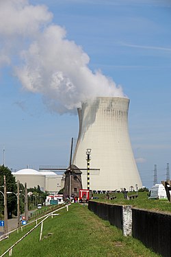 Nuclear power plant cooling tower and windmill in Doel Belgium