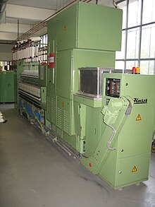 Modern ring spinning machine with doffer Doffer 1.JPG