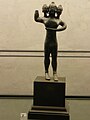 Statuette de bronze étrusque représentant Geryon, possiblement trouvée à Chuisi, 6e siècle avant notre ère. Figurine présenté au Musée des Beaux-Arts de Lyon. Numéro d’inventaire L 1.
