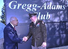 Retired Lt. Gen. Arthur J. Gregg, namesake of the newly named Gregg-Adams Club, is congratulated by Maj. Gen. Mark T. Simerly. Gregg-Adams-Club-1.jpg