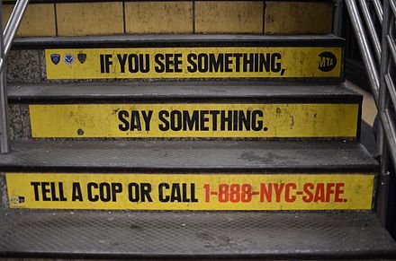 Stairs in the Times Square–42nd Street station painted with the slogan, "If you see something, say something."