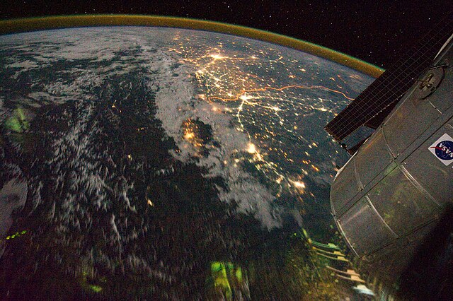 Clusters of yellow lights on the Indo-Gangetic Plain reveal numerous cities large and small in this photograph of northern India and northern Pakistan