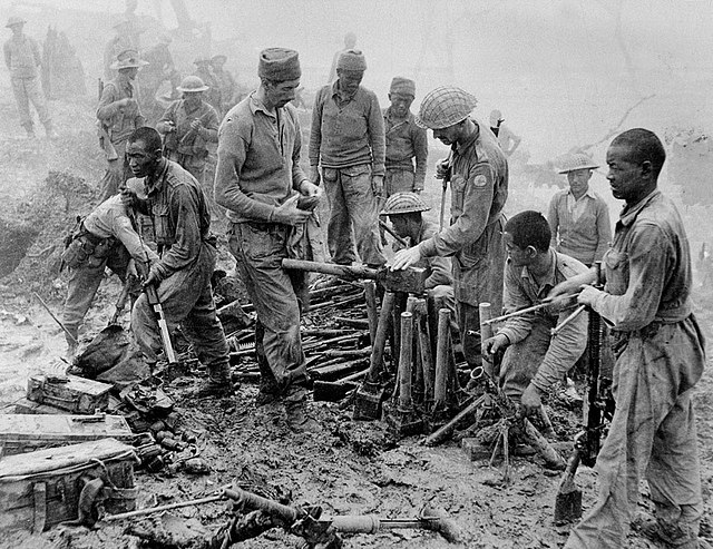 Indian soldiers of the British Indian Army inspect captured Japanese ordnance during the Kohima battle, April 1944