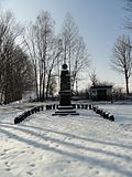 War memorial for the fallen of the First World War, surrounded by a small green area