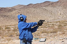 Man aiming SIG Sauer P239.jpg