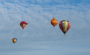 Multiple balloons in the sky during the Frisian balloon parties