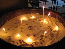 Candles are sometimes burned in churches and cathedrals as a sign of remembrance of the departed Melted Candles.JPG