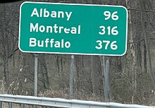 Mileage sign for Albany, Montreal, and Buffalo on NY Thruway/I-87 northbound in Woodbury, New York Mileage Sign on NYS Thruway and I87 NB in Woodbury.jpg