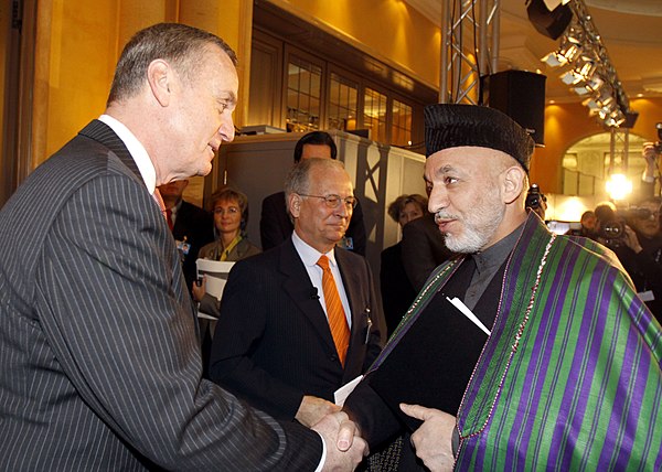 Jones shakes hands with President of Afghanistan Hamid Karzai.